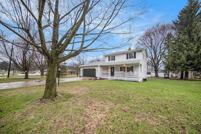 view of front of property with a front yard, a porch, an attached garage, and concrete driveway
