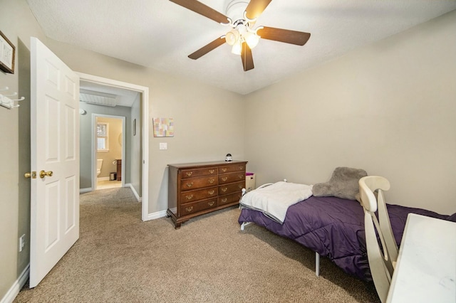bedroom with baseboards, a ceiling fan, and light carpet