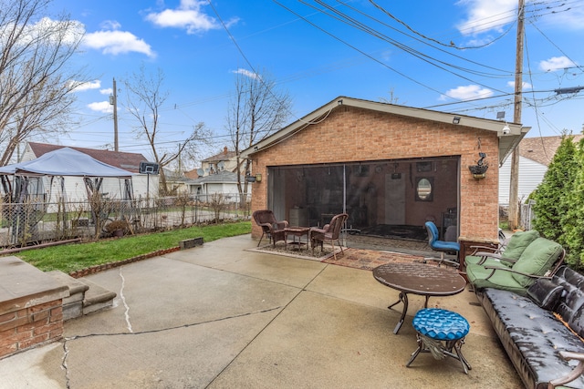6624 Mead St, Dearborn, MI 48126 - rear view of property with a patio, brick siding, and fence