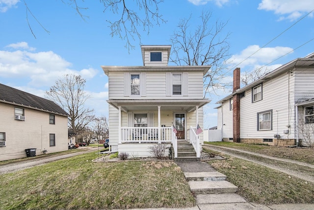 traditional style home featuring a front yard, cooling unit, and covered porch