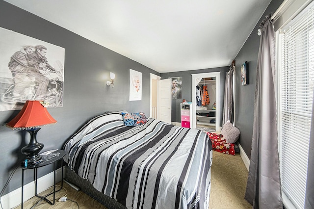 bedroom featuring a closet and baseboards