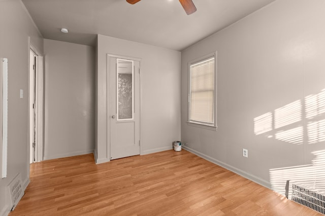 unfurnished bedroom with light wood-style floors, baseboards, and visible vents