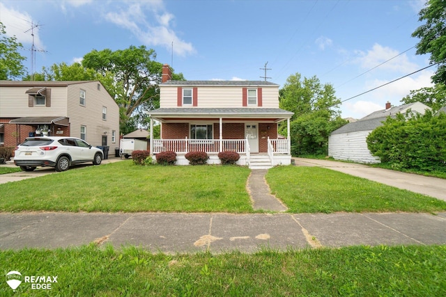 514 Chalmers St, Flint, MI 48503 - view of front of home featuring covered porch, brick siding, a front yard, and a chimney