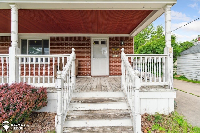 514 Chalmers St, Flint, MI 48503 - entrance to property featuring a porch and brick siding