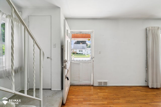 514 Chalmers St, Flint, MI 48503 - foyer entrance featuring healthy amount of natural light, wood finished floors, and baseboards