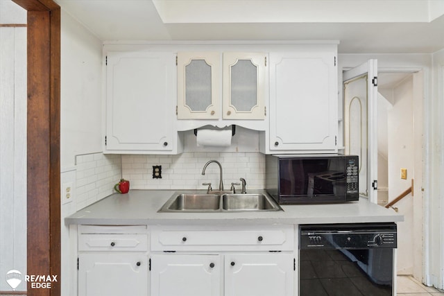 514 Chalmers St, Flint, MI 48503 - kitchen with black appliances, a sink, and white cabinets