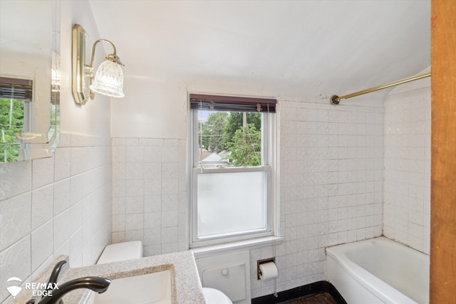 514 Chalmers St, Flint, MI 48503 - bathroom featuring tile walls, toilet, vanity, and shower / tub combination
