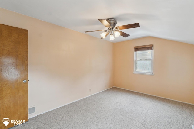 514 Chalmers St, Flint, MI 48503 - carpeted empty room with ceiling fan, vaulted ceiling, and baseboards