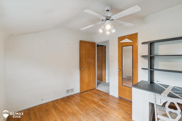 514 Chalmers St, Flint, MI 48503 - unfurnished office with light wood-style flooring, ceiling fan, lofted ceiling, and baseboards
