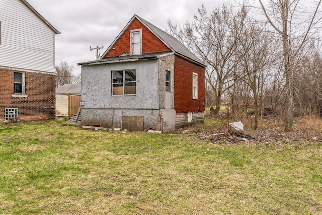 view of home's exterior featuring a yard