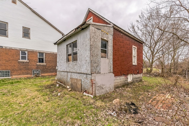 view of home's exterior featuring a lawn