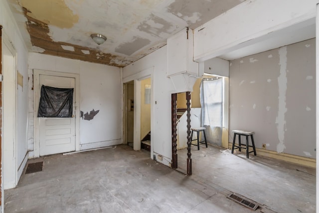 spare room with visible vents and stairs