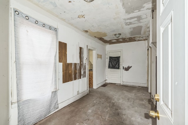 spare room featuring concrete floors
