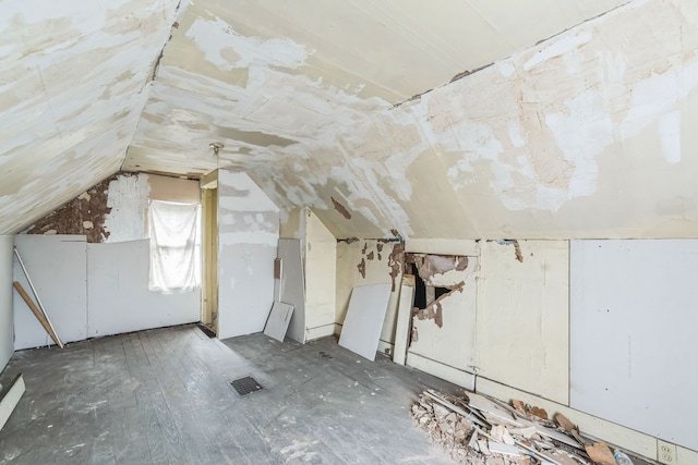 bonus room featuring visible vents and vaulted ceiling