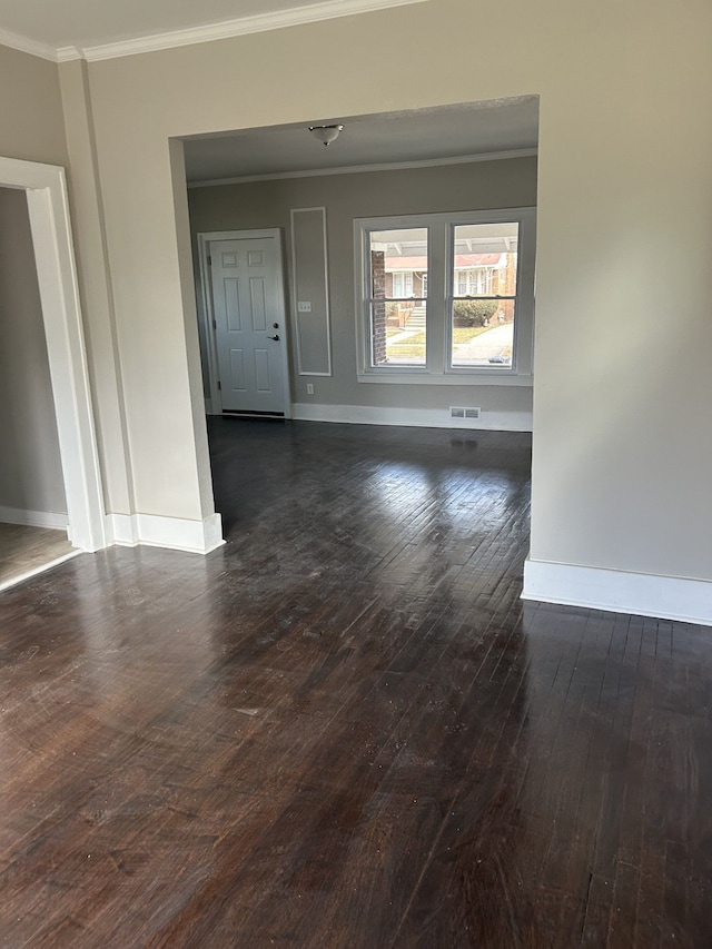 533 Lakewood St, Detroit, MI 48215 - unfurnished room with crown molding, visible vents, baseboards, and dark wood-style flooring