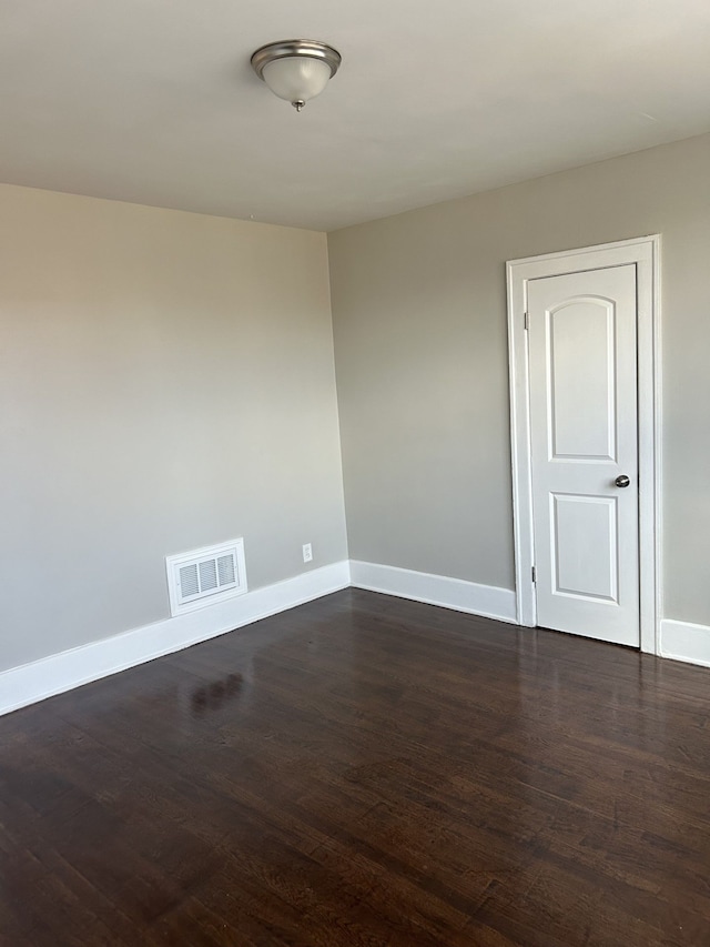 533 Lakewood St, Detroit, MI 48215 - spare room featuring visible vents, baseboards, and dark wood finished floors