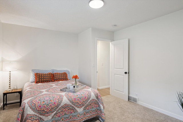 323 13th St, Plainwell, MI 49080 - bedroom with baseboards, carpet, and visible vents