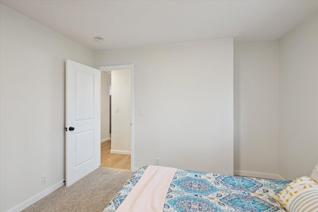 323 13th St, Plainwell, MI 49080 - carpeted bedroom with baseboards