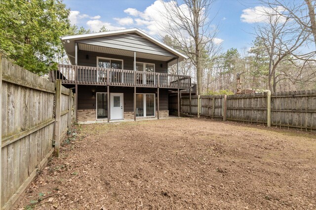 323 13th St, Plainwell, MI 49080 - rear view of property featuring a fenced backyard and a deck