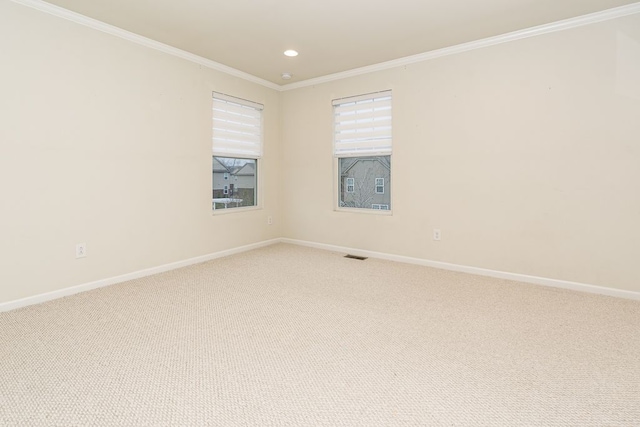 unfurnished room featuring visible vents, baseboards, ornamental molding, recessed lighting, and light colored carpet