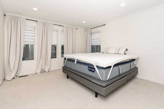 bedroom featuring crown molding, baseboards, and recessed lighting