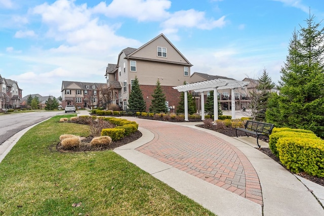 view of property's community with a residential view, a lawn, and a pergola