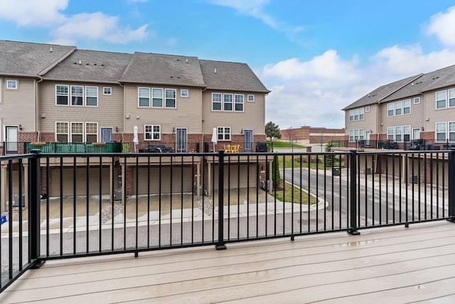 deck with fence and a residential view