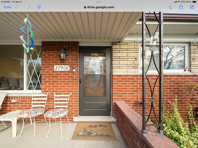 27908 Ryan Rd, Warren, MI 48092 - view of exterior entry featuring brick siding and covered porch