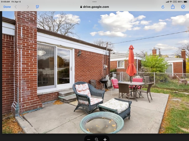 27908 Ryan Rd, Warren, MI 48092 - view of patio featuring fence, entry steps, and outdoor dining space
