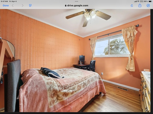 27908 Ryan Rd, Warren, MI 48092 - bedroom with baseboards, wood finished floors, a ceiling fan, and crown molding
