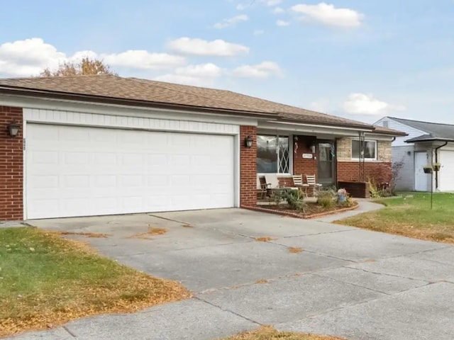 27908 Ryan Rd, Warren, MI 48092 - view of front facade with brick siding, concrete driveway, a garage, and a porch