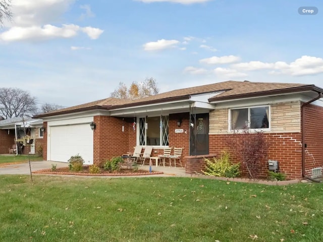 27908 Ryan Rd, Warren, MI 48092 - view of front of house with brick siding, an attached garage, a front yard, a porch, and driveway