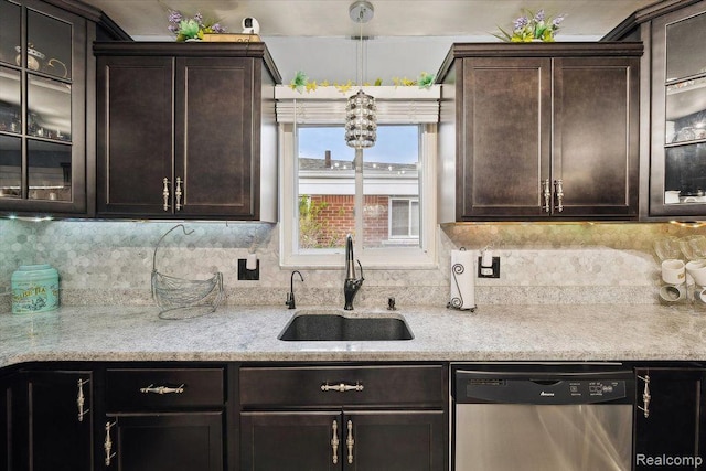 27908 Ryan Rd, Warren, MI 48092 - kitchen with dishwasher, dark brown cabinets, glass insert cabinets, and hanging light fixtures