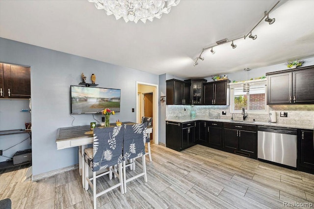 27908 Ryan Rd, Warren, MI 48092 - kitchen featuring stainless steel dishwasher, a chandelier, backsplash, and wood tiled floors