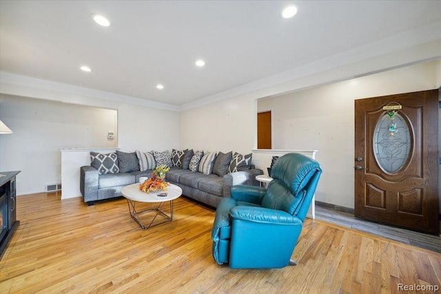 27908 Ryan Rd, Warren, MI 48092 - living area with light wood-type flooring, recessed lighting, and ornamental molding