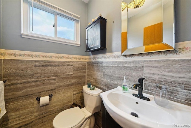 27908 Ryan Rd, Warren, MI 48092 - half bath featuring vanity, tile walls, and wainscoting