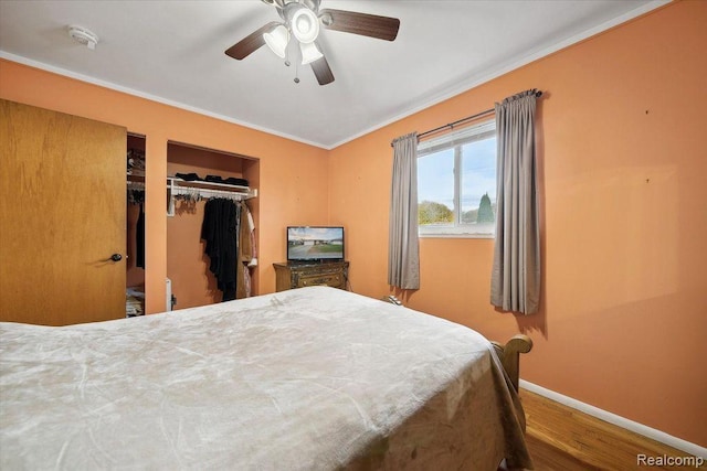 27908 Ryan Rd, Warren, MI 48092 - bedroom featuring wood finished floors, crown molding, a closet, and ceiling fan