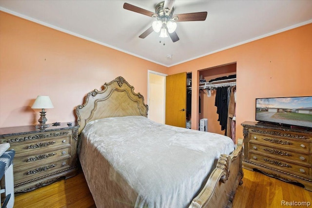 27908 Ryan Rd, Warren, MI 48092 - bedroom featuring wood finished floors, crown molding, a closet, and ceiling fan
