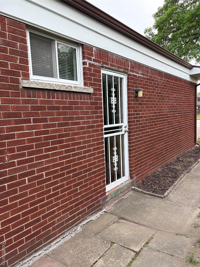 27908 Ryan Rd, Warren, MI 48092 - doorway to property featuring brick siding