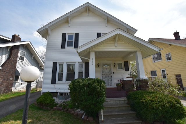 722 E 6th St, Flint, MI 48503 - view of front facade featuring covered porch