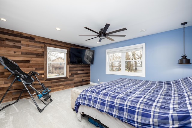 bedroom with recessed lighting, wooden walls, a ceiling fan, and carpet floors