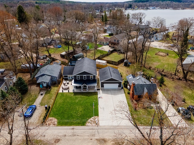 bird's eye view featuring a water view and a residential view