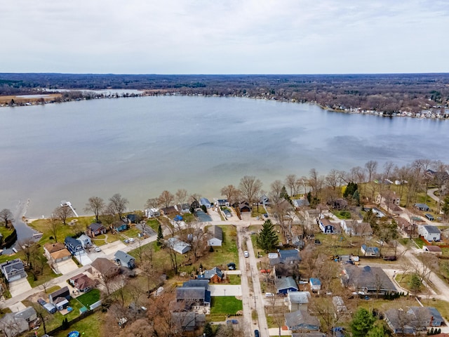 birds eye view of property with a residential view and a water view