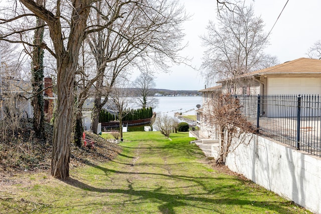view of yard with a garage and fence