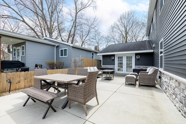 view of patio / terrace with an outdoor hangout area, grilling area, fence, french doors, and outdoor dining space