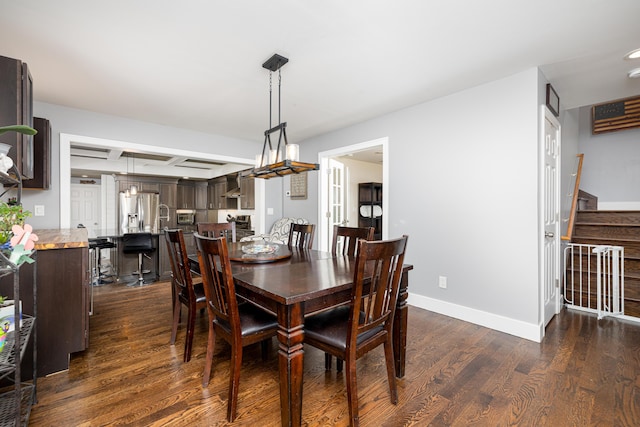 dining room featuring stairway, dark wood-style floors, and baseboards