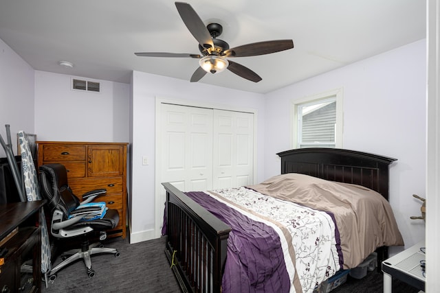 bedroom featuring dark carpet, a closet, a ceiling fan, and visible vents