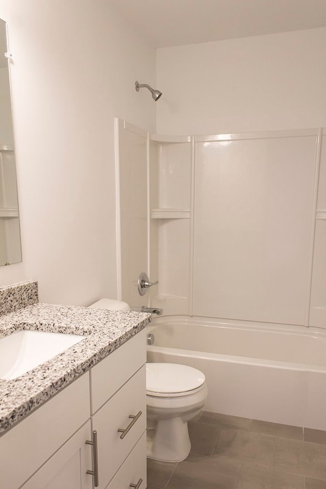 499 Cannonade Loop, Howell, MI 48843 - full bathroom with tile patterned floors, vanity, toilet, and shower / washtub combination