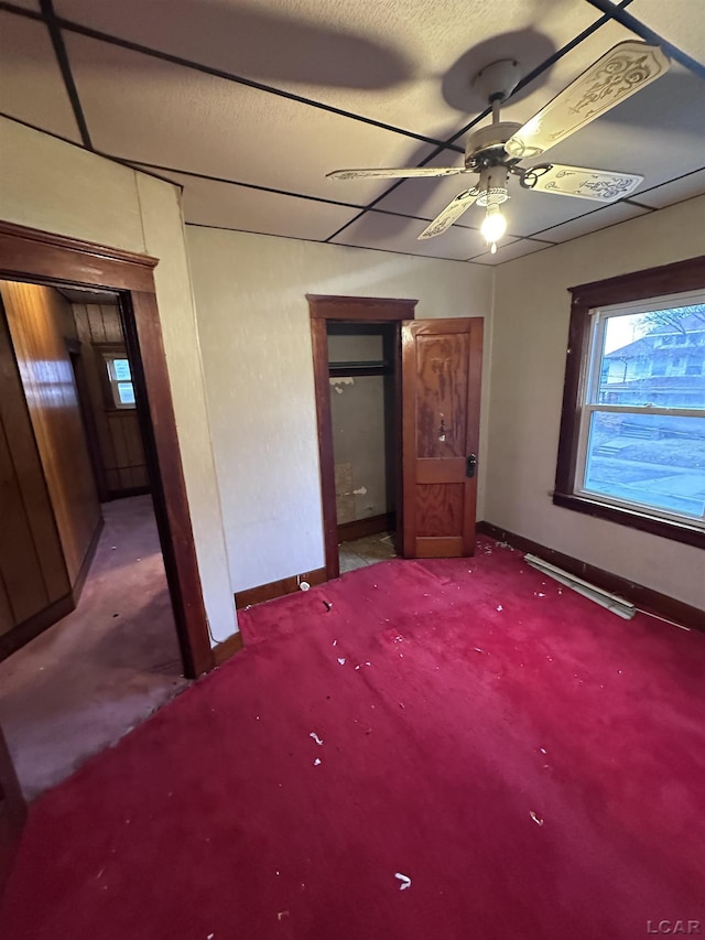 140 Moore St, Jackson, MI 49203 - unfurnished bedroom featuring carpet floors, baseboards, and multiple windows