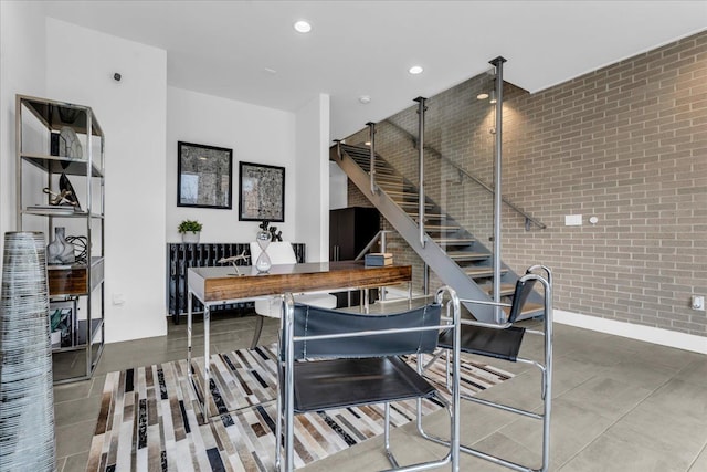 248 Alfred St, Detroit, MI 48201 - dining area with recessed lighting, radiator heating unit, and brick wall